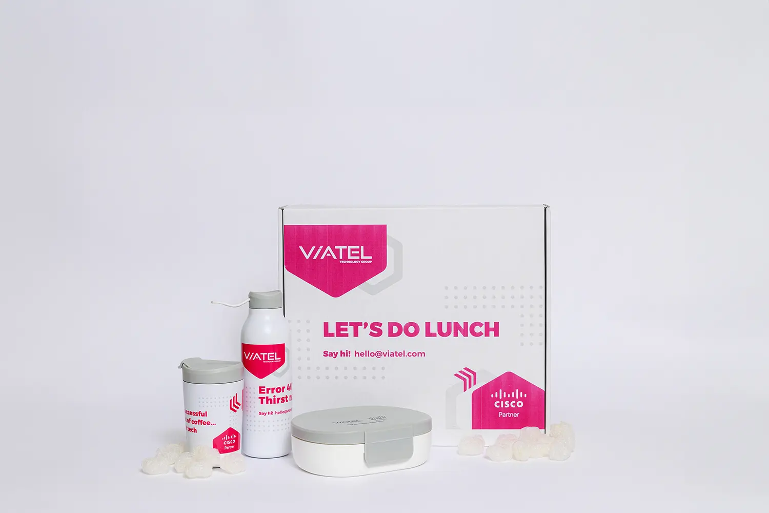An example of a Swag box or gift box for prospective clients of Viatel including a cup, bottle, lunchbox contained in a branded box.